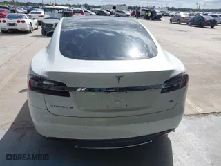 2014 Tesla Model S 60 kWh Battery with VIN 5YJSA1H16EFP51461, listed as a IAAI auction lot 40636898 with 90,762 mi miles. Bid and sale history available at carsss.com. Image 16.