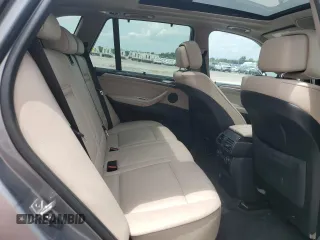 2012 BMW X5 35i with VIN 5UXZV4C59CL991689, listed as a Copart auction lot 64022615 with 208,620 mi miles and Salvage title. Bid and sale history available at DreamBid. Image 11.