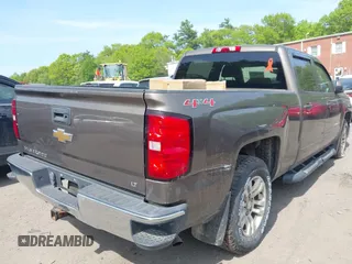 2015 Chevrolet Silverado 1500 LT with VIN 1GCUKREC8FF201315, listed as a IAAI auction lot 42250910 with 137,736 mi miles and . Bid and sale history available at DreamBid. Image 4.