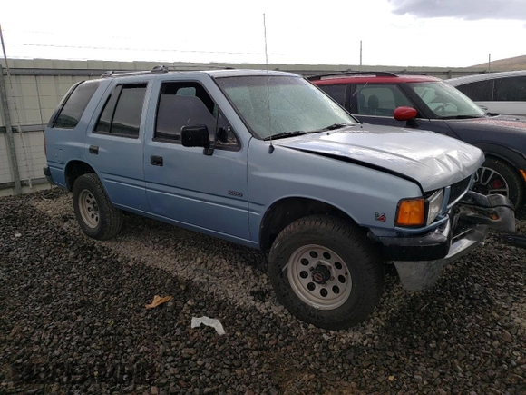 1992 Isuzu Rodeo z VIN 4S2CY58Z2N4333410, wystawiony jako Copart lot #74507154 z przebiegiem 264 327 mil mil oraz Szkody całkowita. Historia ofert i sprzedaży dostępna na DreamBid. Obrazek 4.