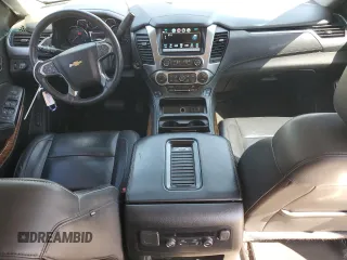 2018 Chevrolet Suburban Premier with VIN 1GNSCJKC1JR199271, listed as a Copart auction lot 52395935 with 216,083 mi miles and Salvage Title. Bid and sale history available at DreamBid. Image 8.