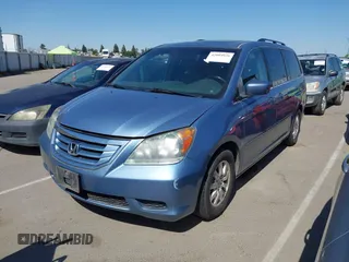 2010 Honda Odyssey EX-L with VIN 5FNRL3H64AB071603, listed as a IAAI auction lot 42084026 with 199,753 mi miles. Bid and sale history available at carsss.com. Image 2.