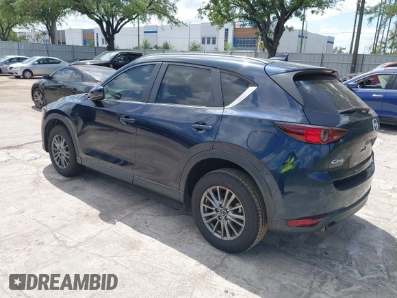2017 Mazda CX-5 Touring with VIN JM3KFACL0H0227615, listed as a IAAI auction lot 42063618 with 72,291 mi miles. Bid and sale history available at carsss.com. Image 3.