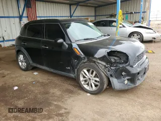 2014 MINI Countryman S with VIN WMWZC5C56EWP38065, listed as a Copart auction lot 59518395 with 91,106 mi miles and Salvage title. Bid and sale history available at DreamBid. Image 4.