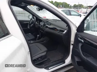 2019 BMW X1 xDrive28i with VIN WBXHT3C54K3H35641, listed as a IAAI auction lot 42241894 with 100,989 mi miles and . Bid and sale history available at DreamBid. Image 5.
