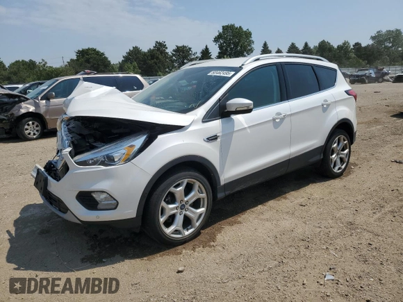 2019 Ford Escape Titanium z VIN 1FMCU9J93KUA51020, wystawiony jako Copart lot #60462495 z przebiegiem 59 998 mil mil oraz Szkoda całkowita • Salvage title. Historia ofert i sprzedaży dostępna na DreamBid. Obrazek 1.