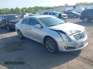 2013 Cadillac XTS with VIN 2G61N5S31D9135710, listed as a IAAI auction lot 42002480 with 162,029 mi miles. Bid and sale history available at carsss.com. Image 1.
