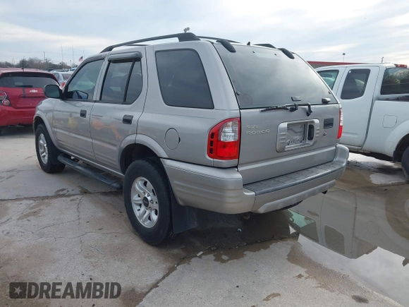 2004 Isuzu Rodeo S z VIN 4S2CK58W344311048, wystawiony jako IAAI lot #41472392 z przebiegiem 128 732 mil mil oraz . Historia ofert i sprzedaży dostępna na DreamBid. Obrazek 3.
