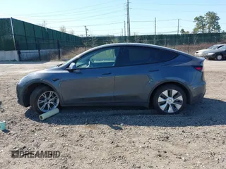 2022 Tesla Model Y Long Range with VIN 7SAYGDEE2NF460945, listed as a IAAI auction lot 41921645 with 62,318 mi miles and . Bid and sale history available at DreamBid. Image 13.