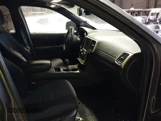 2014 Jeep Grand Cherokee Laredo with VIN 1C4RJEAG7EC145023, listed as a IAAI auction lot 40518825 with 115,098 mi miles and . Bid and sale history available at DreamBid. Image 5.