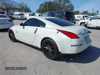 2004 Nissan 350Z Touring with VIN JN1AZ34E74T064156, listed as a IAAI auction lot 41498213 with 148,370 mi miles. Bid and sale history available at carsss.com. Image 3.