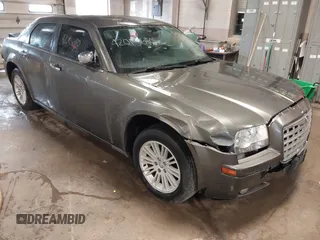 2010 Chrysler 300 Touring with VIN 2C3CA5CV9AH101800, listed as a IAAI auction lot 42015640 with 128,457 mi miles and . Bid and sale history available at DreamBid. Image 1.