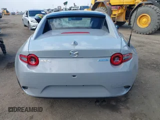 2024 Mazda MX-5 Miata Grand Touring z VIN JM1NDAM76R0602860, wystawiony jako IAAI lot #41346197 z przebiegiem 1 891 mil mil oraz . Historia ofert i sprzedaży dostępna na DreamBid. Obrazek 16.
