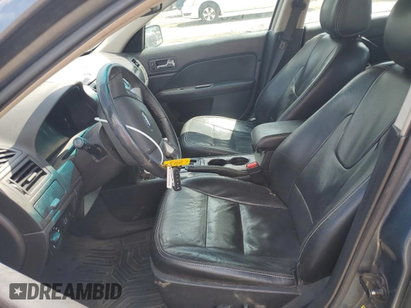 2012 Ford Fusion SEL z VIN 3FAHP0JG7CR297174, wystawiony jako Copart lot #55469005 z przebiegiem 129 434 mil mil oraz Szkoda całkowita • Salvage title. Historia ofert i sprzedaży dostępna na DreamBid. Obrazek 7.