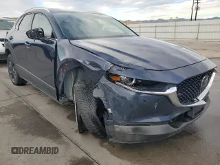 2023 Mazda CX-30 Premium Plus with VIN 3MVDMBEY9PM500907, listed as a Copart auction lot 70871494 with 38,599 mi miles and Salvage title. Bid and sale history available at DreamBid. Image 4.