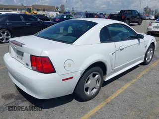 2004 Ford Mustang Standard with VIN 1FAFP40674F186503, listed as a IAAI auction lot 41915483 with 157,864 mi miles. Bid and sale history available at carsss.com. Image 4.