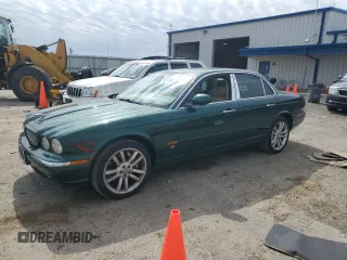 2004 Jaguar XJ R z VIN SAJWA73B94TG28693, wystawiony jako Copart lot #50840275 z przebiegiem 174 429 mil mil oraz Czysty tytuł • Clean title. Historia ofert i sprzedaży dostępna na DreamBid. Obrazek 1.