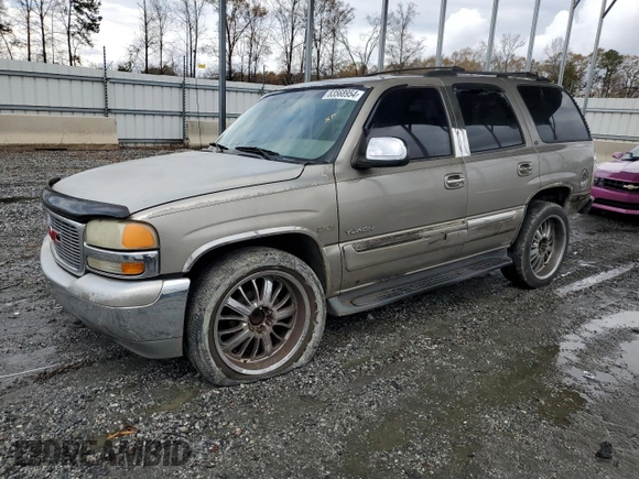 2001 GMC Yukon SLT z VIN 1GKEC13T51J145673, wystawiony jako Copart lot #83568954 z przebiegiem 310 415 mil mil oraz Szkoda całkowita • Salvage title. Historia ofert i sprzedaży dostępna na DreamBid. Obrazek 1.