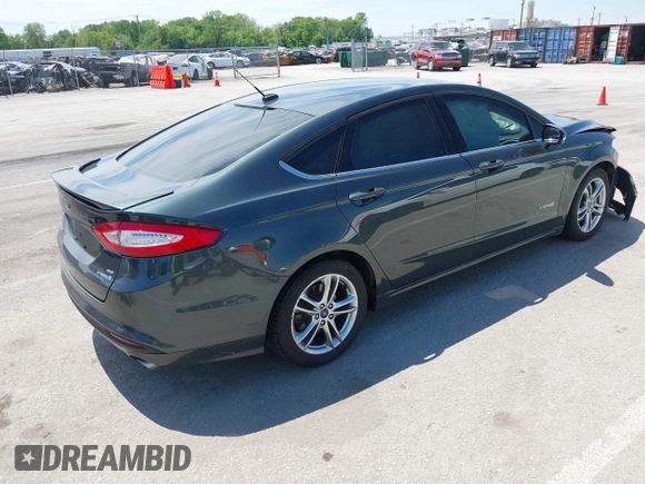 2015 Ford Fusion SE Hybrid with VIN 3FA6P0LU7FR224823, listed as a IAAI auction lot 42199479 with 81,835 mi miles and . Bid and sale history available at DreamBid. Image 4.