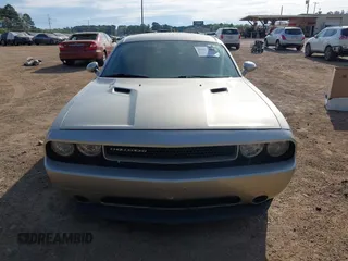 2013 Dodge Challenger SXT z VIN 2C3CDYAG7DH679444, wystawiony jako IAAI lot #41855484 z przebiegiem 158 741 mil mil oraz . Historia ofert i sprzedaży dostępna na DreamBid. Obrazek 12.
