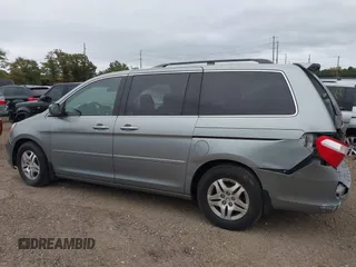 2005 Honda Odyssey EX-L with VIN 5FNRL38625B041067, listed as a IAAI auction lot 40519464 with 117,606 mi miles and . Bid and sale history available at carsss.com. Image 3.