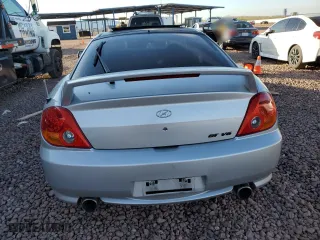 2004 Hyundai Tiburon GT with VIN KMHHN65F44U130202, listed as a Copart auction lot 43193404 with 207,694 mi miles and Salvage Title. Bid and sale history available at carsss.com. Image 6.