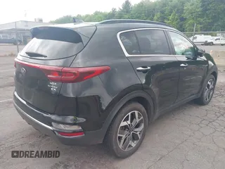 2021 Kia Sportage EX with VIN KNDPNCAC5M7848673, listed as a IAAI auction lot 42373684 with 108,409 mi miles and . Bid and sale history available at DreamBid. Image 4.