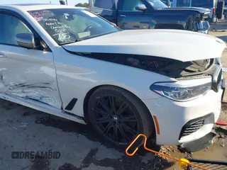 2018 BMW 5 Series M550i xDrive with VIN WBAJB9C54JB050218, listed as a IAAI auction lot 41132695 with 69,659 mi miles. Bid and sale history available at carsss.com. Image 1.