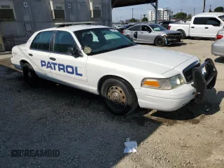 2011 Ford Police Interceptor z VIN 2FABP7BV7BX131779, wystawiony jako Copart lot #59364255 z przebiegiem 118 964 mil mil oraz Czysty tytuł • Clean title. Historia ofert i sprzedaży dostępna na DreamBid. Obrazek 4.
