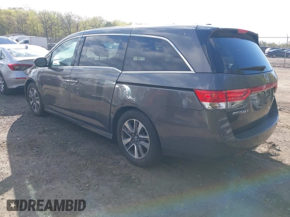 2015 Honda Odyssey Touring Elite with VIN 5FNRL5H99FB094727, listed as a IAAI auction lot 42001288 with 254,015 mi miles and . Bid and sale history available at DreamBid. Image 3.