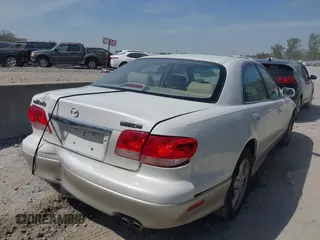 2001 Mazda Millenia with VIN JM1TA221011711379, listed as a IAAI auction lot 41897580 with 151,307 mi miles and . Bid and sale history available at DreamBid. Image 4.