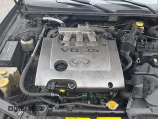 2002 Infiniti I35 Luxury with VIN JNKDA31A92T013997, listed as a IAAI auction lot 41781369 with 206,413 mi miles. Bid and sale history available at carsss.com. Image 10.