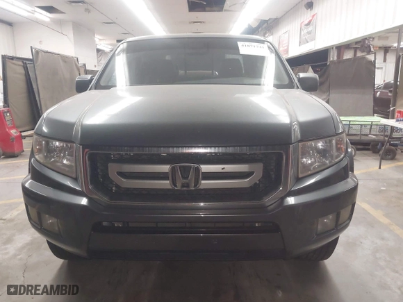 2011 Honda Ridgeline RTL with VIN 5FPYK1F57BB004189, listed as a IAAI auction lot 41871741 with 193,913 mi miles. Bid and sale history available at carsss.com. Image 12.