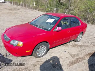 2002 Kia Spectra GS with VIN KNAFB161425076186, listed as a IAAI auction lot 42007615 with 90,269 mi miles. Bid and sale history available at carsss.com. Image 2.
