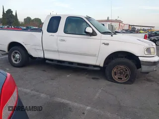 1999 Ford F-150 XL with VIN 1FTRX18L1XKB61205, listed as a IAAI auction lot 40991236 with 178,889 mi miles. Bid and sale history available at carsss.com. Image 13.