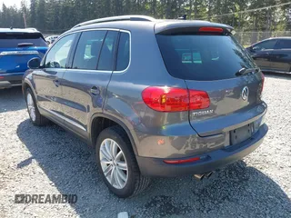2013 Volkswagen Tiguan SEL with VIN WVGBV3AX1DW595673, listed as a IAAI auction lot 42140263 with 77,457 mi miles and . Bid and sale history available at DreamBid. Image 3.
