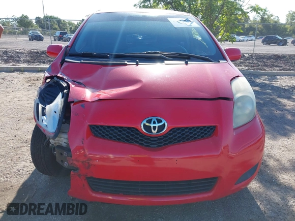 2009 Toyota Yaris with VIN JTDJT903695234623, listed as a IAAI auction lot 42027852 with 146,000 mi miles. Bid and sale history available at carsss.com. Image 12.