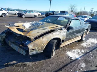 1986 Pontiac Firebird Trans Am with VIN 1G2FW87F6GN210279, listed as a IAAI auction lot 41260317 with 124,290 mi miles. Bid and sale history available at carsss.com. Image 2.