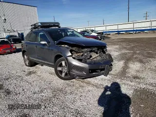 2014 Volkswagen Touareg Lux z VIN WVGEF9BP1ED007974, wystawiony jako Copart lot #82627834 z przebiegiem Nie podano mil oraz Szkoda całkowita • Salvage title. Historia ofert i sprzedaży dostępna na DreamBid. Obrazek 11.