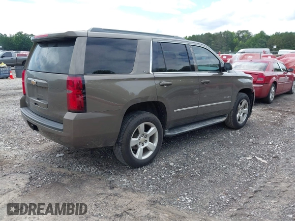 2015 Chevrolet Tahoe LT with VIN 1GNSCBKC5FR585138, listed as a IAAI auction lot 42420496 with 177,104 mi miles and . Bid and sale history available at DreamBid. Image 4.
