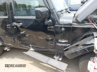 2015 Jeep Wrangler Unlimited Sahara with VIN 1C4HJWEG3FL661568, listed as a IAAI auction lot 42387810 with 140,927 mi miles and . Bid and sale history available at DreamBid. Image 17.