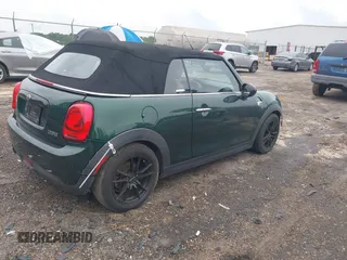 2016 MINI Convertible with VIN WMWWG5C51G3C19231, listed as a IAAI auction lot 42246342 with 93,876 mi miles and . Bid and sale history available at DreamBid. Image 4.