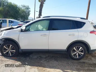 2017 Toyota RAV4 XLE with VIN JTMWFREV9HJ128521, listed as a IAAI auction lot 41658054 with 106,788 mi miles and . Bid and sale history available at DreamBid. Image 14.