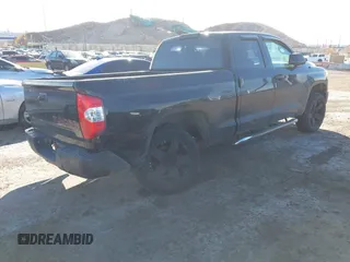 2016 Toyota Tundra 4WD Truck SR with VIN 5TFUM5F16GX064418, listed as a IAAI auction lot 41504912 with 215,241 mi miles. Bid and sale history available at carsss.com. Image 4.