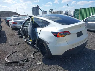 2023 Tesla Model Y Long Range with VIN 7SAYGDEE4PF780951, listed as a IAAI auction lot 41856461 with 63,317 mi miles. Bid and sale history available at carsss.com. Image 3.
