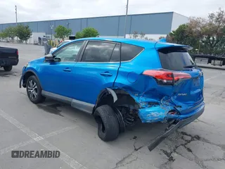 2018 Toyota RAV4 LE with VIN 2T3BFREV6JW740214, listed as a IAAI auction lot 42106349 with 105,831 mi miles and . Bid and sale history available at carsss.com. Image 18.