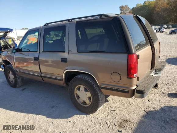 1996 Chevrolet Tahoe with VIN 1GNEK13R1TJ385350, listed as a Copart auction lot 77593884 with 169,178 mi miles and Salvage Title. Bid and sale history available at carsss.com. Image 2.