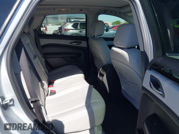 2013 Cadillac SRX Premium Collection z VIN 3GYFNEE36DS556446, wystawiony jako IAAI lot #42289824 z przebiegiem 23 988 mil mil oraz . Historia ofert i sprzedaży dostępna na DreamBid. Obrazek 8.
