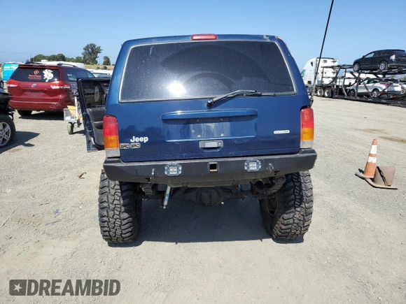 2000 Jeep Cherokee with VIN 1J4FF48S3YL126931, listed as a Copart auction lot 57593305 with Not provided miles and Non repairable. Bid and sale history available at DreamBid. Image 6.