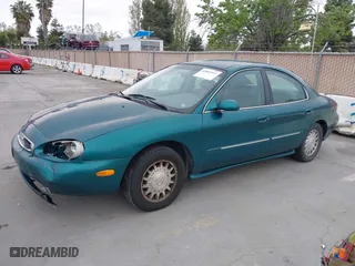 1996 Mercury Sable LS with VIN 1MELM53S0TG600877, listed as a IAAI auction lot 42063937 with 200,405 mi miles. Bid and sale history available at carsss.com. Image 2.
